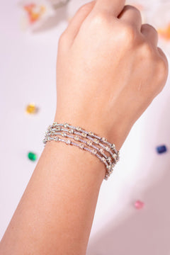 Yellow and clear oval-cut crystal tennis bracelet worn on a model's wrist – Duavaa
