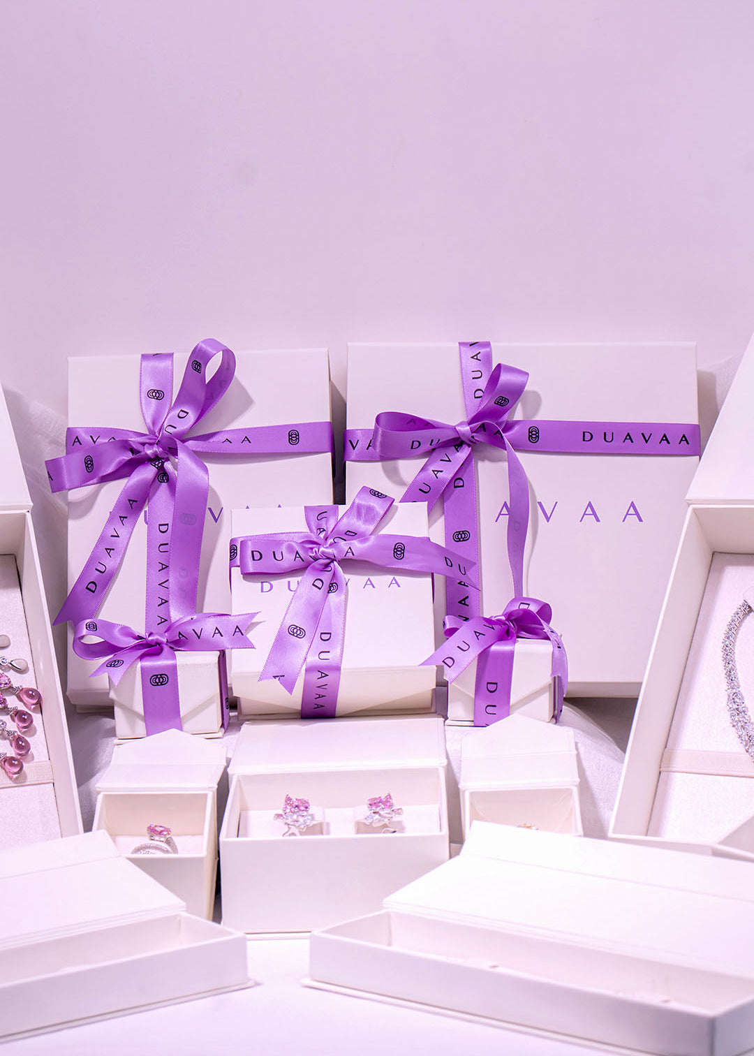 Duavaa jewellery gift boxes with purple ribbon and assorted pieces in white packaging – Duavaa