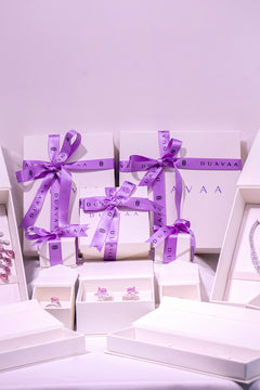 Duavaa jewellery gift boxes with purple ribbon and assorted pieces in white packaging – Duavaa