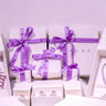 Duavaa jewellery gift boxes with purple ribbon and assorted pieces in white packaging – Duavaa