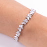 White diamante CZ tennis bracelet with pear and round stones worn on wrist – Duavaa