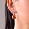 Orange citrine pear teardrop drop earring with round CZ stud worn on the ear – Duavaa
