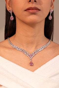 Pink teardrop CZ V-shaped necklace and drop earrings worn on neck and ear – Duavaa