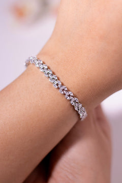 Clear marquise-cut CZ tennis bracelet worn on a model's wrist – Duavaa