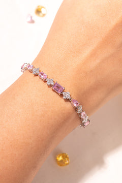 Blush pink mixed-cut tennis bracelet with crystal accents worn on wrist – Duavaa