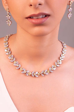 Yellow and clear crystal layered floral necklace set with matching earrings worn on neck – Duavaa