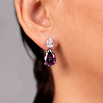 Purple pear-cut crystal drop earrings worn on the ear – Duavaa