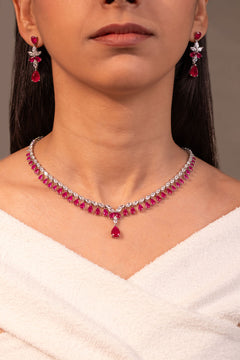 Red stone necklace and drop earrings worn on neck and ears – Duavaa