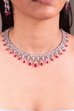 Red pear drop fringe necklace with white marquise leaves worn on model – Duavaa
