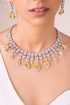 Yellow pear-cut and crystal floral statement necklace set with drops worn on neck – Duavaa