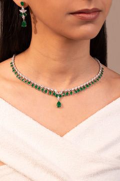 Green stone necklace and drop earrings worn on neck and ear – Duavaa