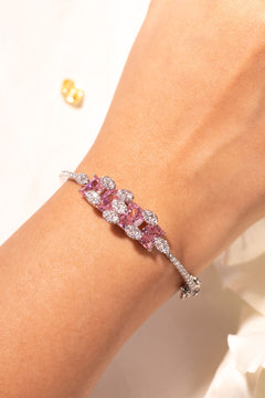 Pink princess-cut bracelet with pavé crystal clusters worn on wrist – Duavaa