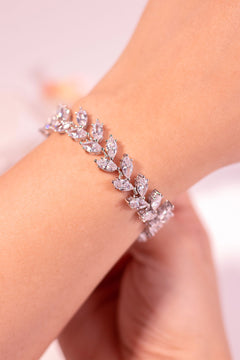 Clear marquise-cut crystal leaf-pattern tennis bracelet worn on a wrist – Duavaa
