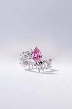 Blush pink pear-cut crystal ring framed with brilliant stones worn on the finger – Duavaa