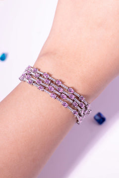 Pink oval-cut three-row layered CZ bracelet worn on a model's wrist – Duavaa