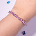 Pink oval-cut tennis bracelet worn on wrist – Duavaa