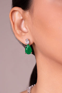 Green pear-cut crystal drop earrings worn on the ear – Duavaa