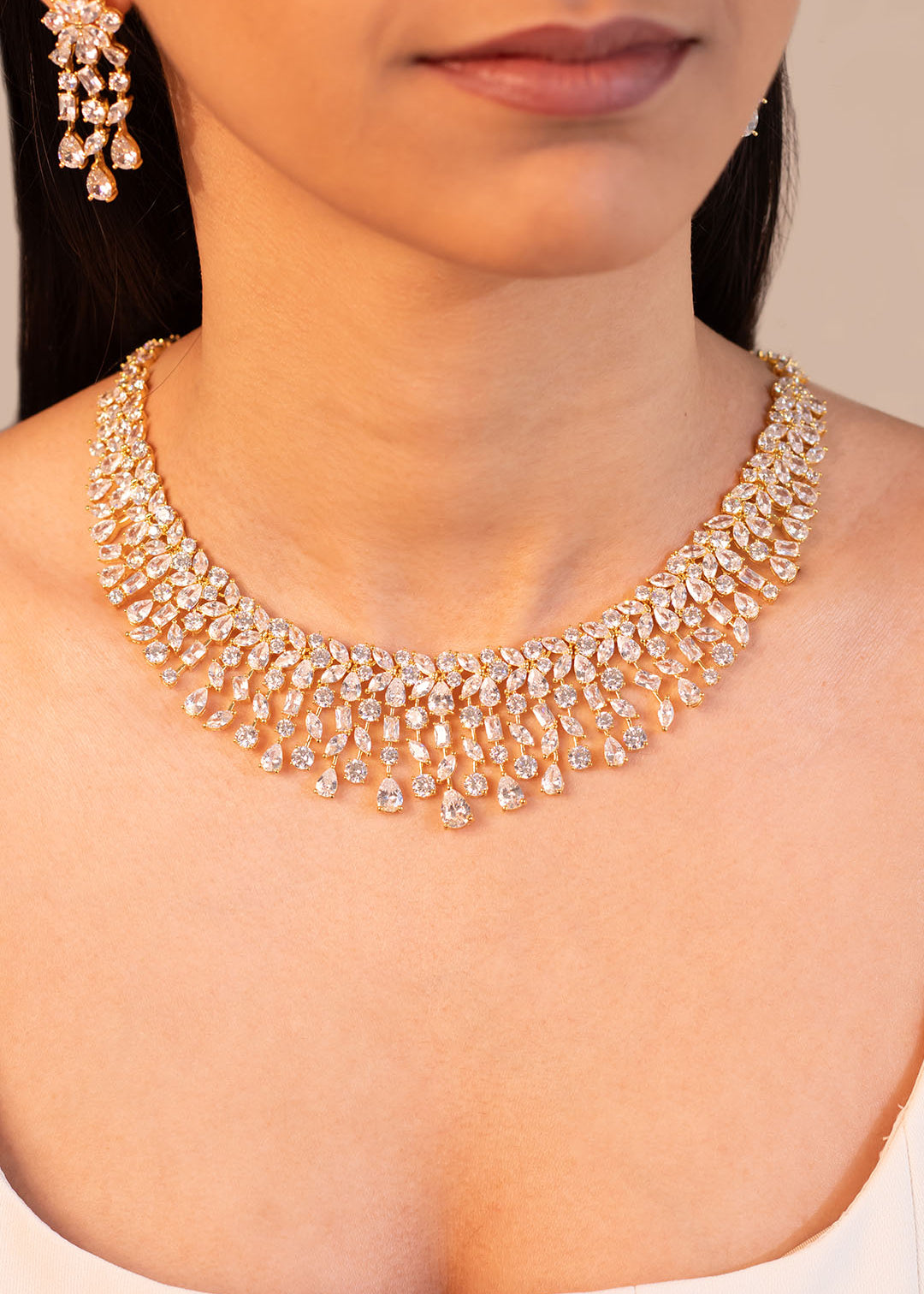 Crystal cluster necklace with pear drop centrepiece worn on the neck – Duavaa