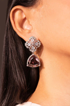 Plum trilliant-cut crystal drop earring with floral stud worn on the ear – Duavaa