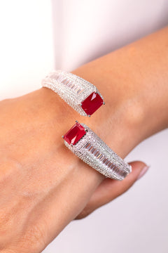 Red emerald-cut open cuff bracelet with baguette and pave rows worn on wrist – Duavaa