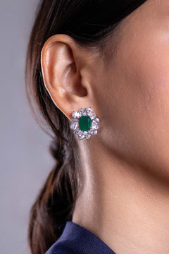 Emerald green crystal halo stud earring worn on model's ear, close-up – Duavaa