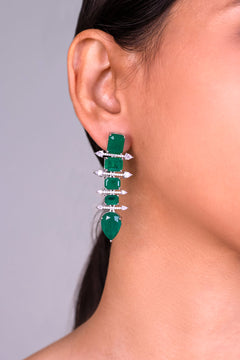 Emerald green square and pear-cut stone drop earring with pave CZ bars worn on ear – Duavaa